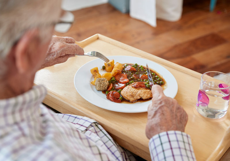 Elderly man eating a nutritious meal