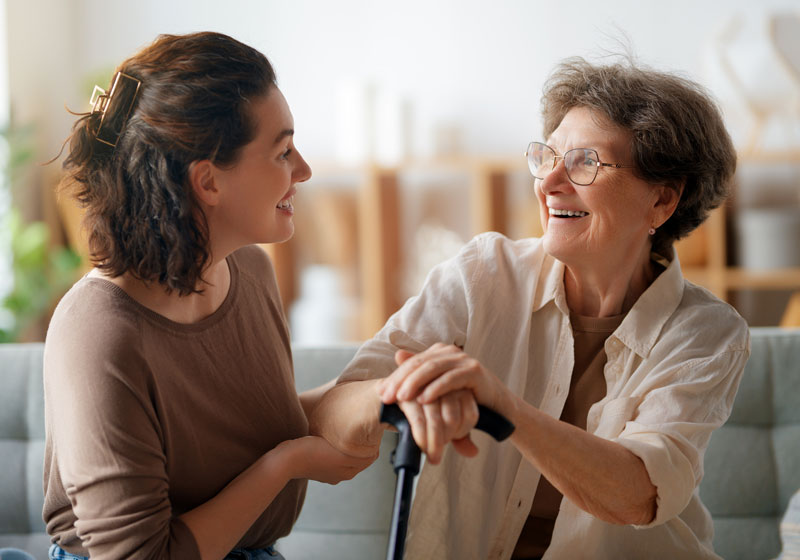 Senior Care worker talking with an elderly women.